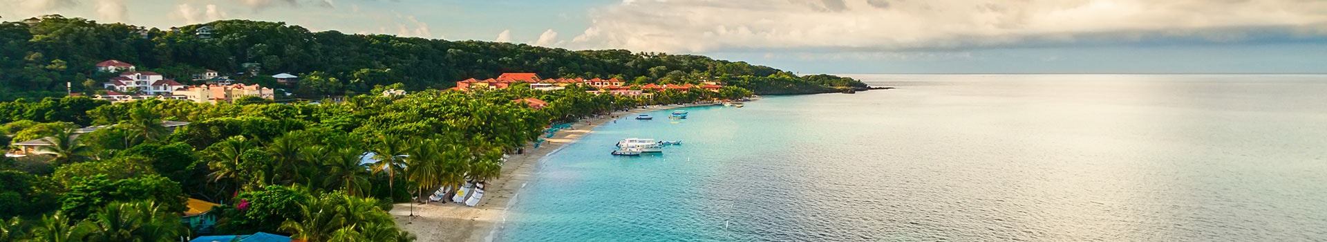 Voo + Hotel a **Roatan**